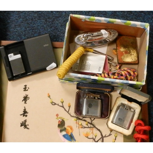 136 - Various cigarette lighters, an ibex horn walking cane, a framed silk work picture.