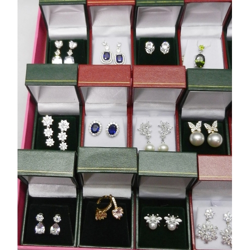 48 - A collection of white metal stone set earrings, pendants, etc all seemingly unused, most boxed.