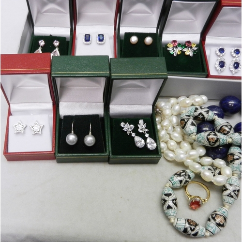 49 - A collection of white metal stone set earrings all seemingly unused together with a cultured pearl n... 