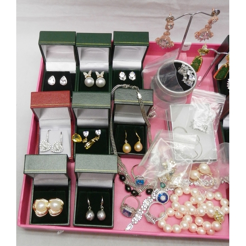 50 - A collection of white metal stone set earrings, all seemingly unused; a stone set necklace etc.