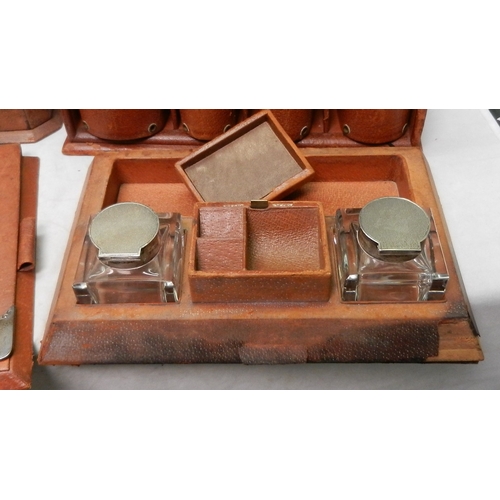 81 - An Asprey London desk set, pigskin covered with silver mounts.  The set comprising a fold cover stat... 