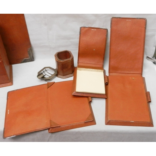 81 - An Asprey London desk set, pigskin covered with silver mounts.  The set comprising a fold cover stat... 