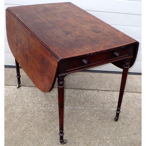 577 - A Regency mahogany Pembroke table on turned legs, chip in rule joint