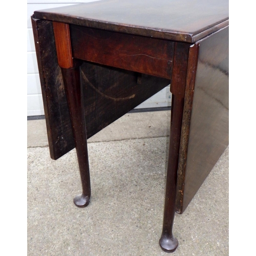 578 - A Geo III mahogany drop leaf table on pad feet, restorations