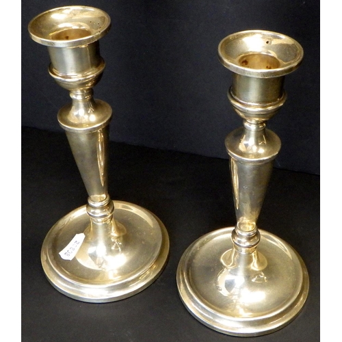 580 - A pair of silver “filled” candlesticks 20cm tall