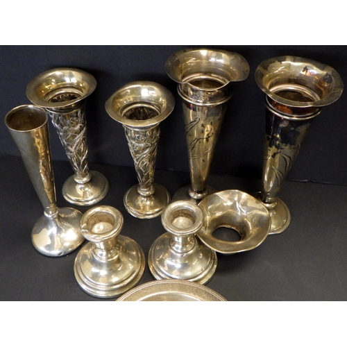 581 - Two pairs of silver spill vases , squat silver candlesticks ALL FILLED BASES together with a silver ... 