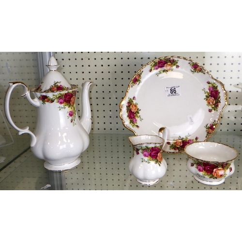 86 - A large group of Royal Albert Country Rose tea / coffee ware (qty)