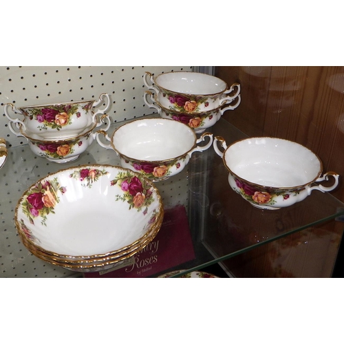 87 - A large group of Royal Albert Country Rose dinner ware (qty)