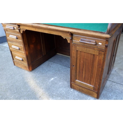 527 - An Edwardian walnut roll top desk, 153cm wide, with brass label Forest City, Furniture Co, Rockford,... 