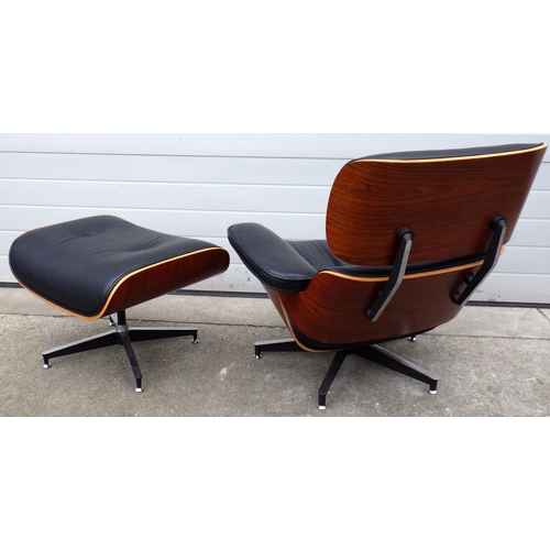 547 - A reproduction Eames style recliner chair and stool (2)