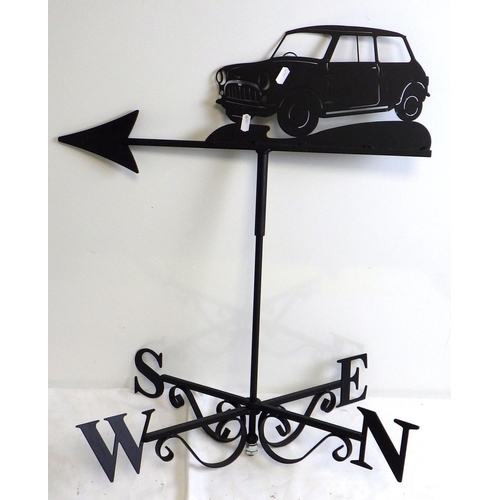 A metal weather vane, surmounted by a Mini car, 68cm tall