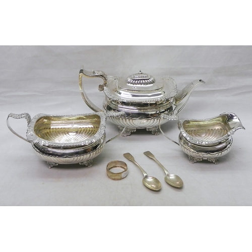 A George III silver three piece tea set, Charles Fox I, London 1819, teapot 290mm long; together with two silver spoons and a silver napkin ring 1310g gross