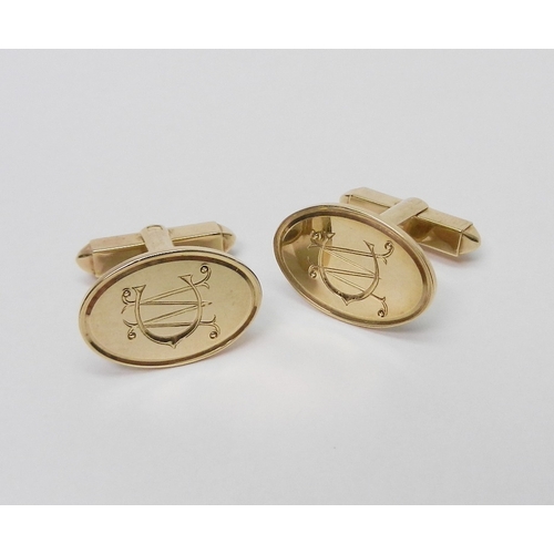 A pair of 9ct gold cufflinks, the oval heads both engraved with monogram MC or CM.  Heads 20  x 14mm / 10g