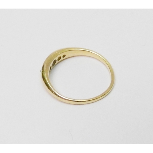 24 - An 18ct gold five stone diamond ring, the graduated stones pave set in a boat shaped head.  Central ... 