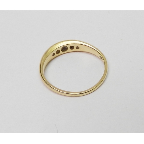 24 - An 18ct gold five stone diamond ring, the graduated stones pave set in a boat shaped head.  Central ... 