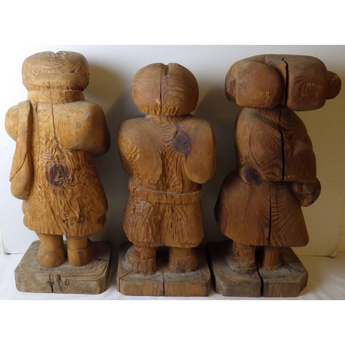 301 - Attributed to Gordon Young, Three large carved wooden figures 60 cm tall. VAT & Buyers Premium apply... 