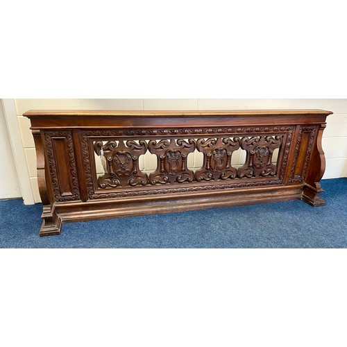 A carved walnut pew front 220 cm wide 75cm high, ex York Minster