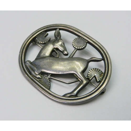 1 - Georg Jensen: a silver brooch depicting a deer in foliage, design number 256.  45 x 35mm