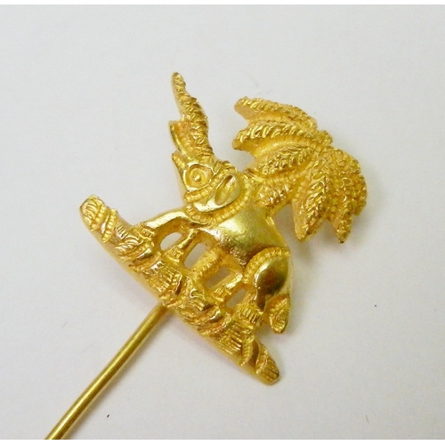 64 - A pair of chain link cufflinks comprising an elephant and palm tree motif head and a plain oval back... 