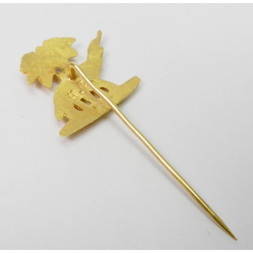 64 - A pair of chain link cufflinks comprising an elephant and palm tree motif head and a plain oval back... 