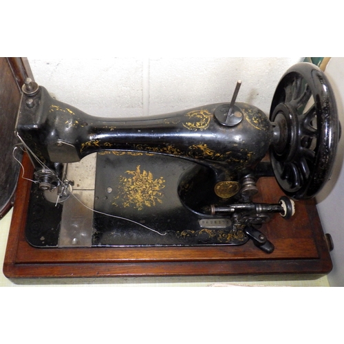 19 - A Singer sewing machine, kitchenalia incl flat irons. (2)