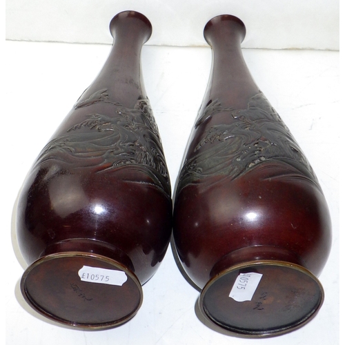 4 - A pair of Japanese Meiji period bronze vases, the bases signed with a character mark.  Approx 26cm t... 