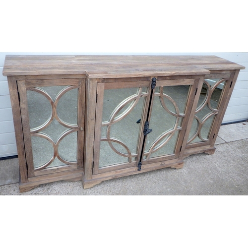 642 - An Oka rustic breakfront cabinet with mirrored doors, 200cm wide