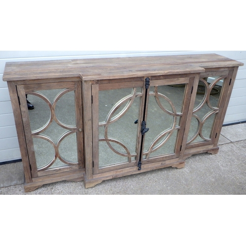 642 - An Oka rustic breakfront cabinet with mirrored doors, 200cm wide