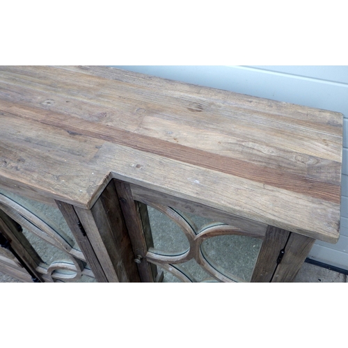 642 - An Oka rustic breakfront cabinet with mirrored doors, 200cm wide