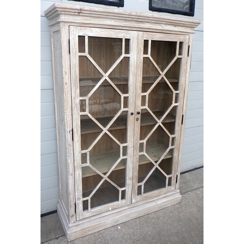 A Coach House rustic limed finish cabinet, 188cm tall, 127cm wide