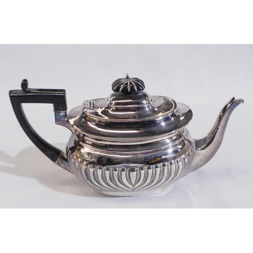 A late Victorian silver bachelor's teapot having an ebonised handle and knop, presentation engraving dated 1896, Charles Boyton, London, 1895.  237mm long / 290g gross.  a/f base and spout distorted.