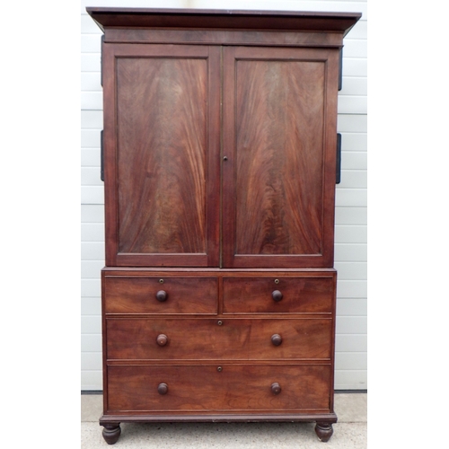 633 - A 19th cen mahogany linen press 223cm tall, missing one inner slide drawer