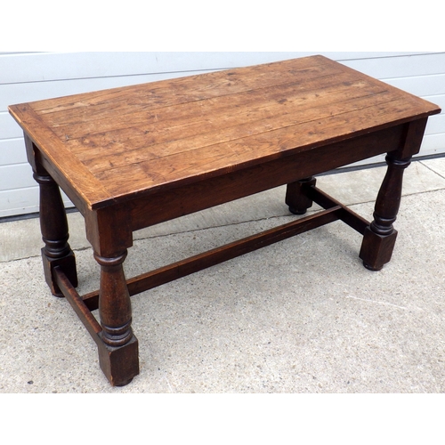 An oak side table on turned legs, corner chipped, 137cm long, ex York Minster