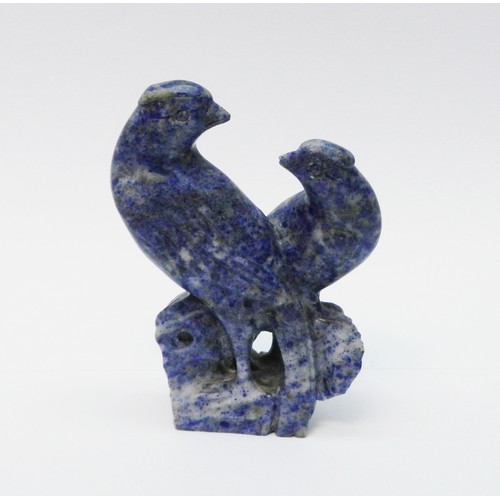 A Chinese figural finial (?) depicting a pair of song birds, carved lapis lazuli.  120mm tall.