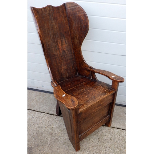 A rustic oak chair, 109cm tall