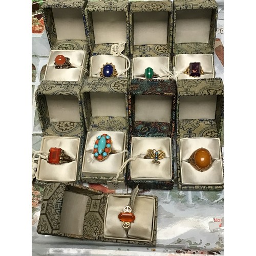 224 - Nine Chinese cocktail rings: variously stone set white metal / gilt white metal. All boxed, unused.