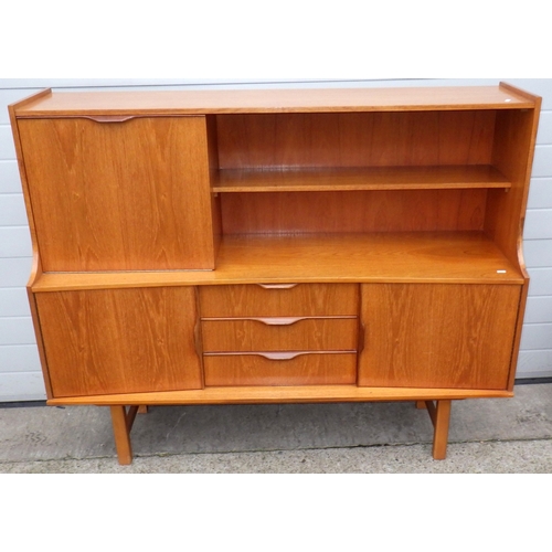 610 - A teak highbooard, some damage to corner, small crack, 151cm wide