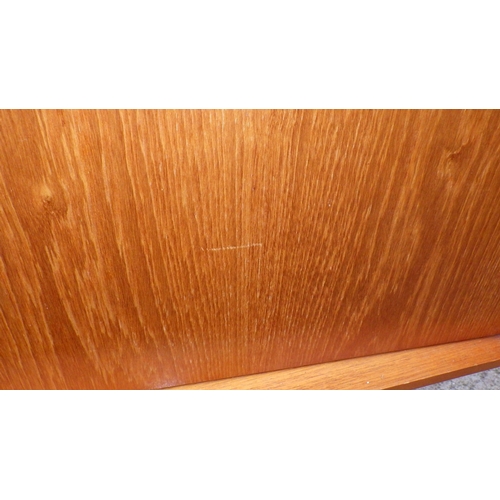 610 - A teak highbooard, some damage to corner, small crack, 151cm wide