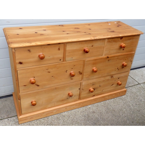 632 - A modern pine chest of drawers, 142cm wide together with a modern light oak t.v stand, marks (2)