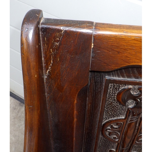 637 - A panelled oak hall settle, 55cm wide