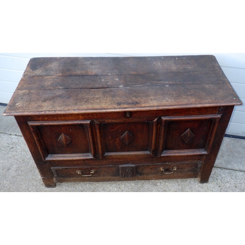 656 - A three panel oak coffer with lower drawer, 122cm wide (a/f)