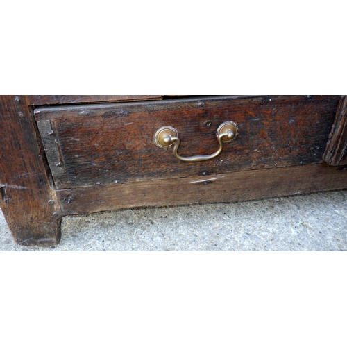 656 - A three panel oak coffer with lower drawer, 122cm wide (a/f)