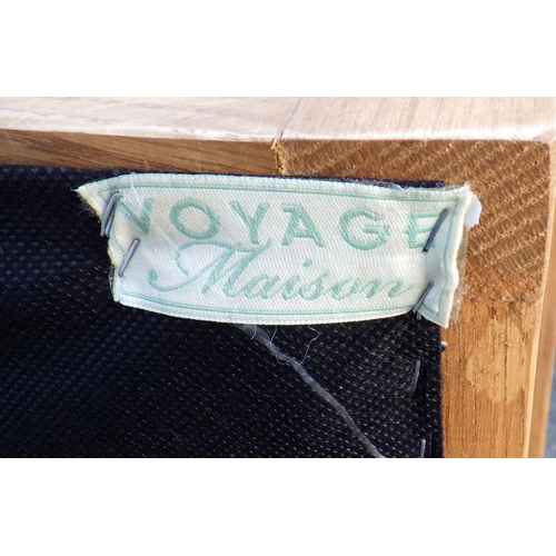 664 - A modern oak rocking chair with label, 