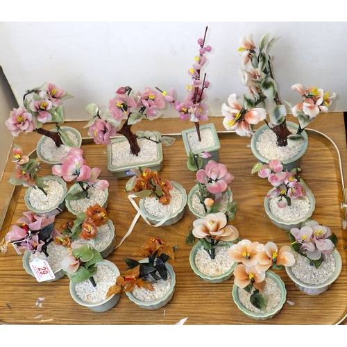 29 - A group of Oriental glass bonsai trees in celadon pots, 10-25cm tall