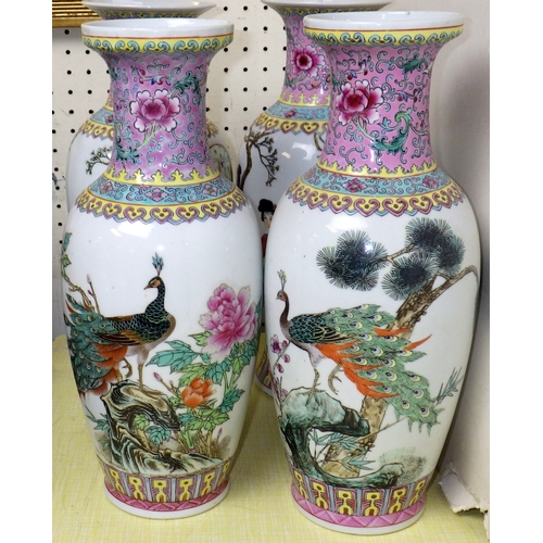 52 - Four pairs of Chinese Famille Rose vases, 24-31cm tall