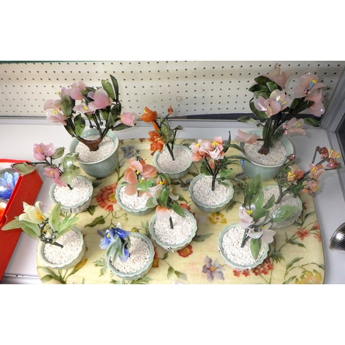 95 - A group of Oriental glass bonsai trees in celadon pots, 10-20cm tall