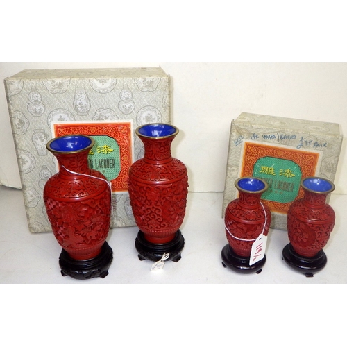 119 - Two pairs of Chinese Red Cinnabar vases with blue enamel interior, 12 & 18cm tall