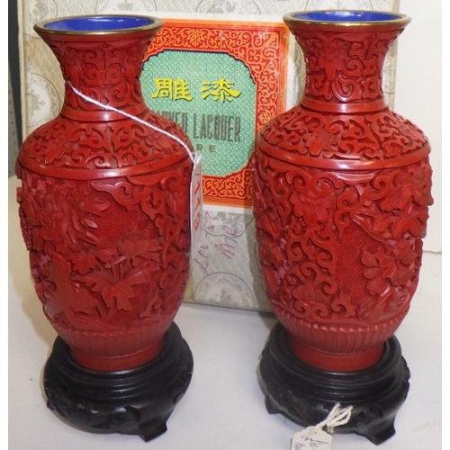 119 - Two pairs of Chinese Red Cinnabar vases with blue enamel interior, 12 & 18cm tall