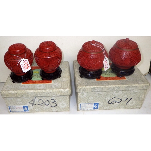 125 - Two pairs of Chinese Red Cinnabar lidded ginger jars with blue enamel interior, 14cm tall