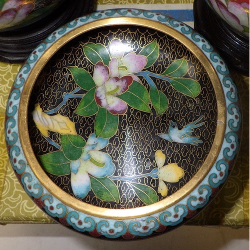 136 - A pair of cloisonné floral ginger jars, 17cm tall, and matching bowl
